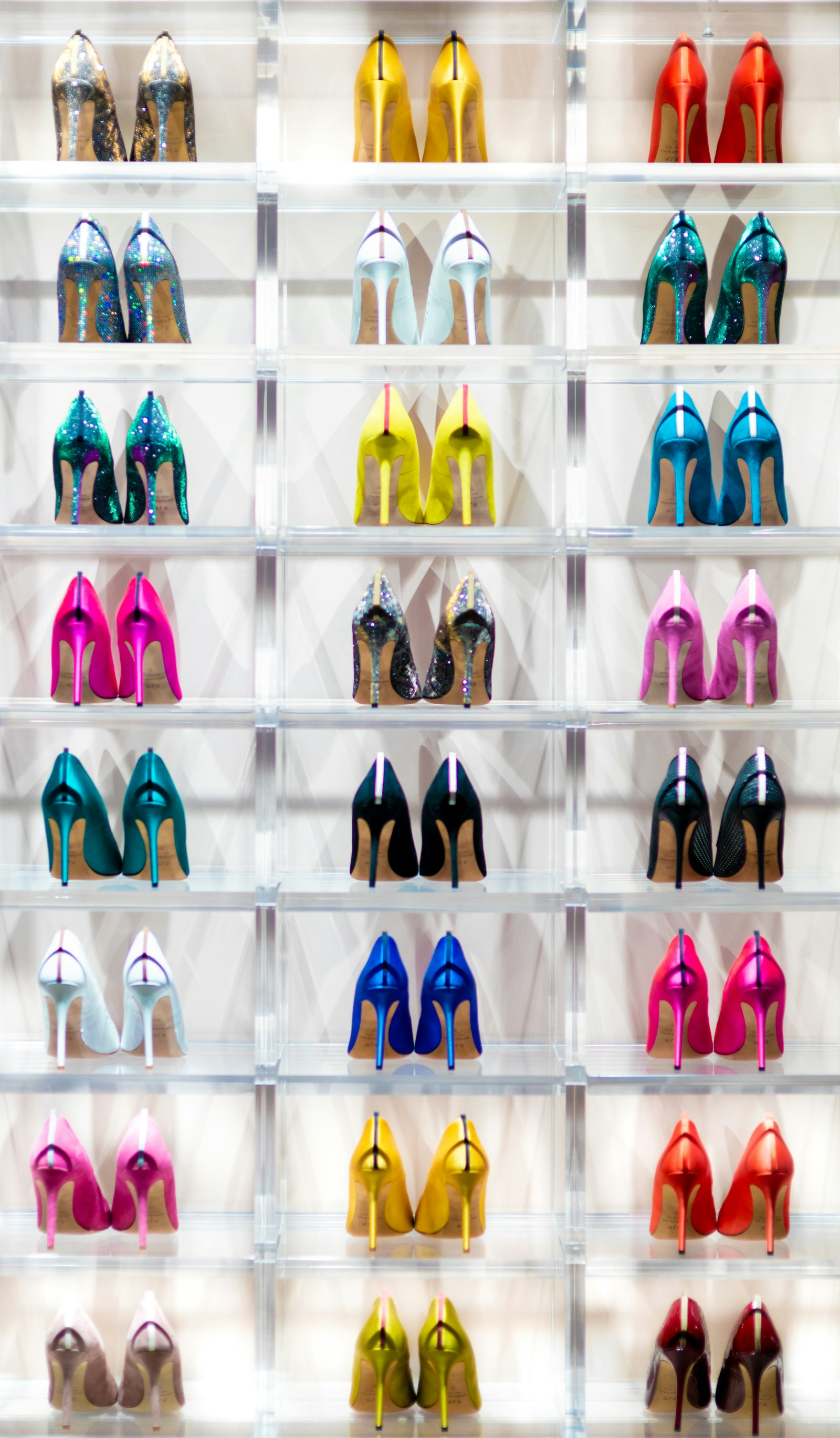 Wall of colourful high heels in a shoe boutique